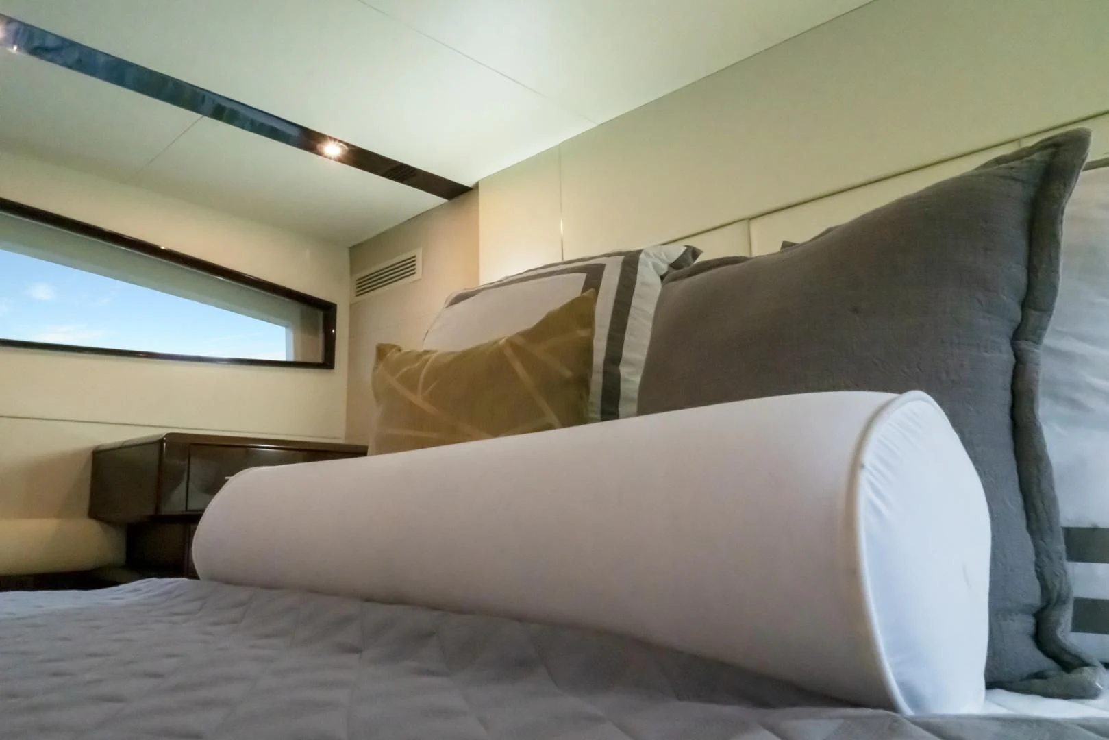 a bed with a white pillow aboard SALACIA Yacht for Sale