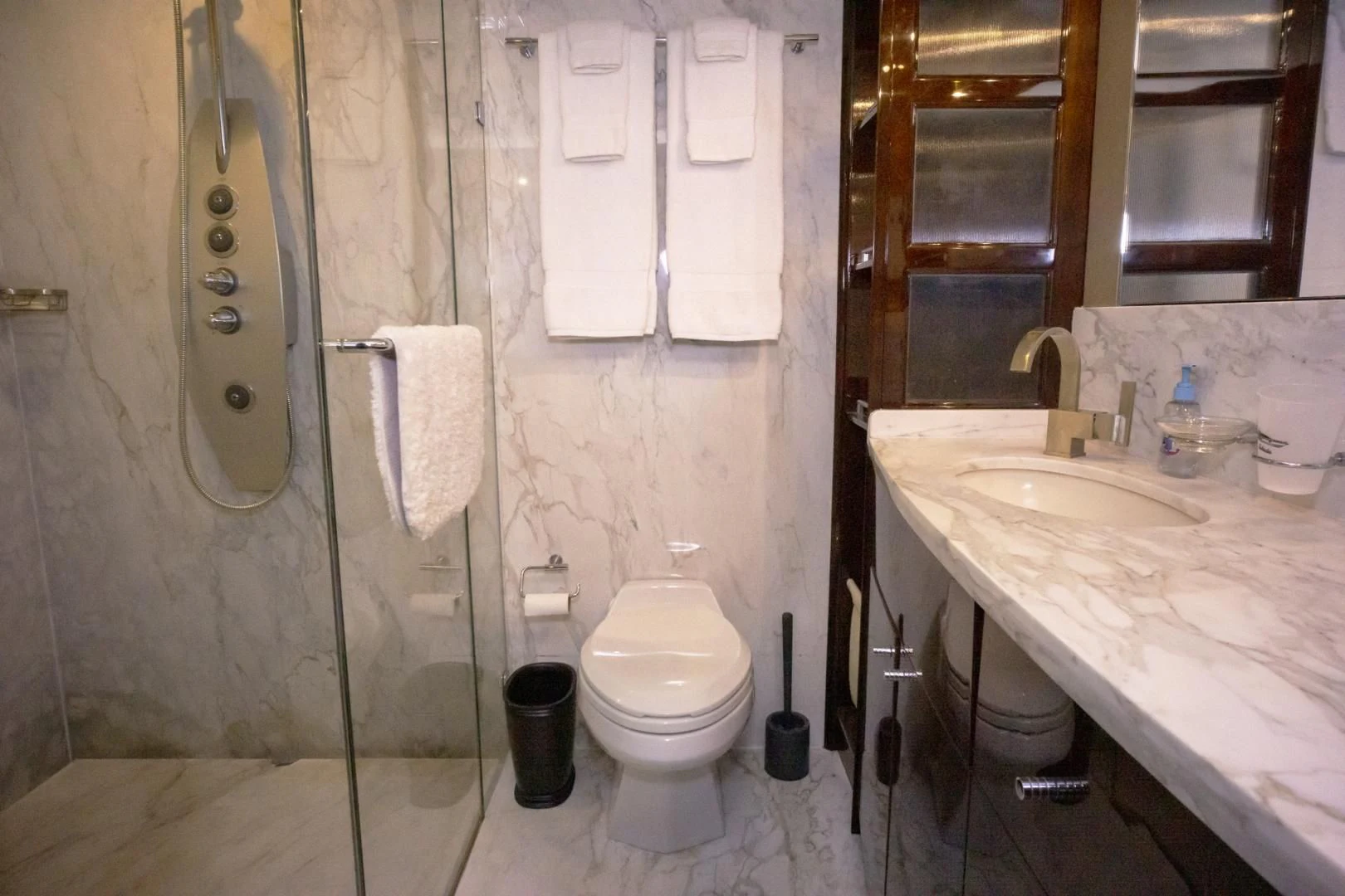 a bathroom with a shower and sink aboard SALACIA Yacht for Sale