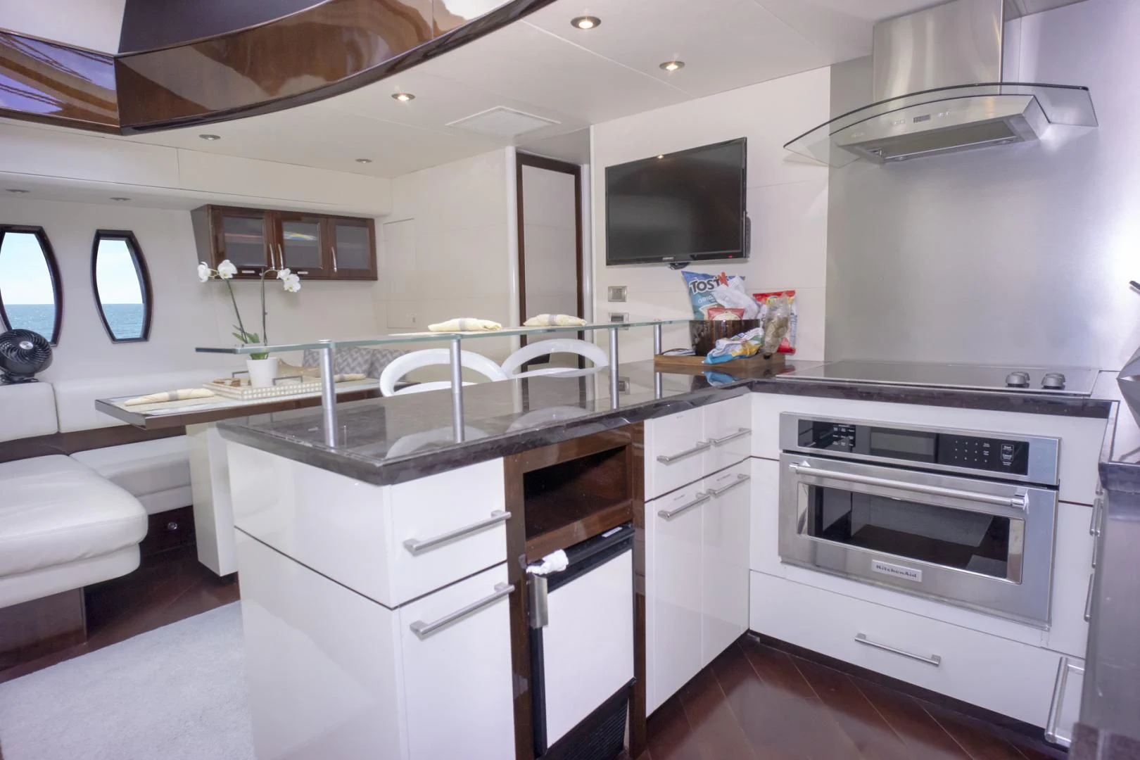 a kitchen with white cabinets aboard SALACIA Yacht for Sale