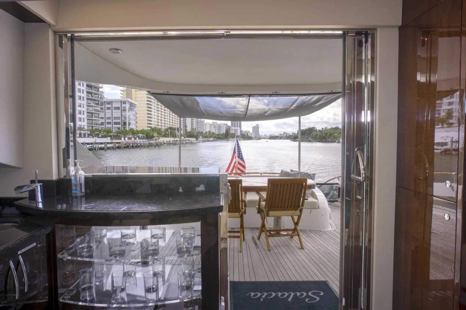 a room with a table and chairs aboard SALACIA Yacht for Sale