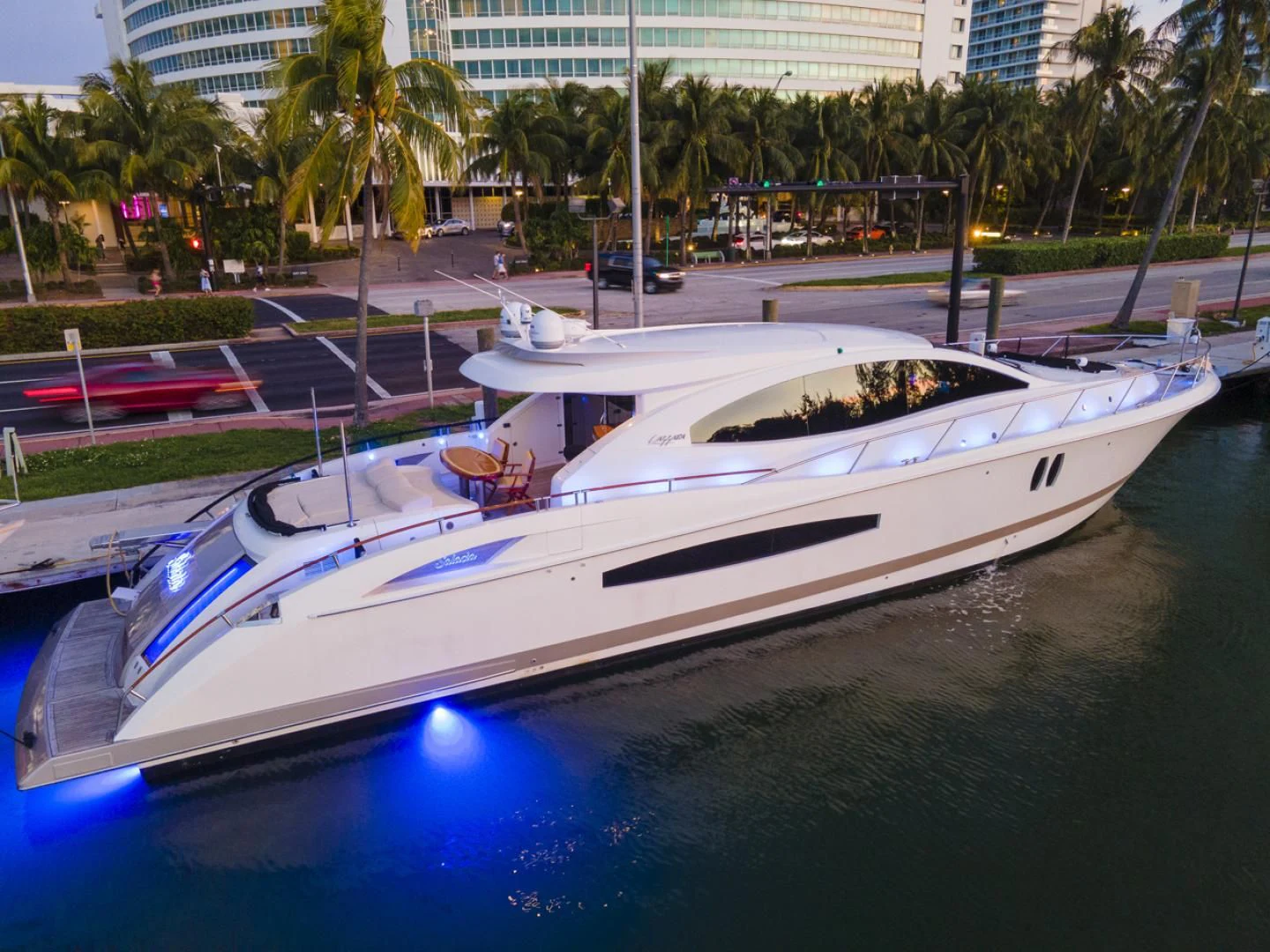 a white boat on a body of water aboard SALACIA Yacht for Sale
