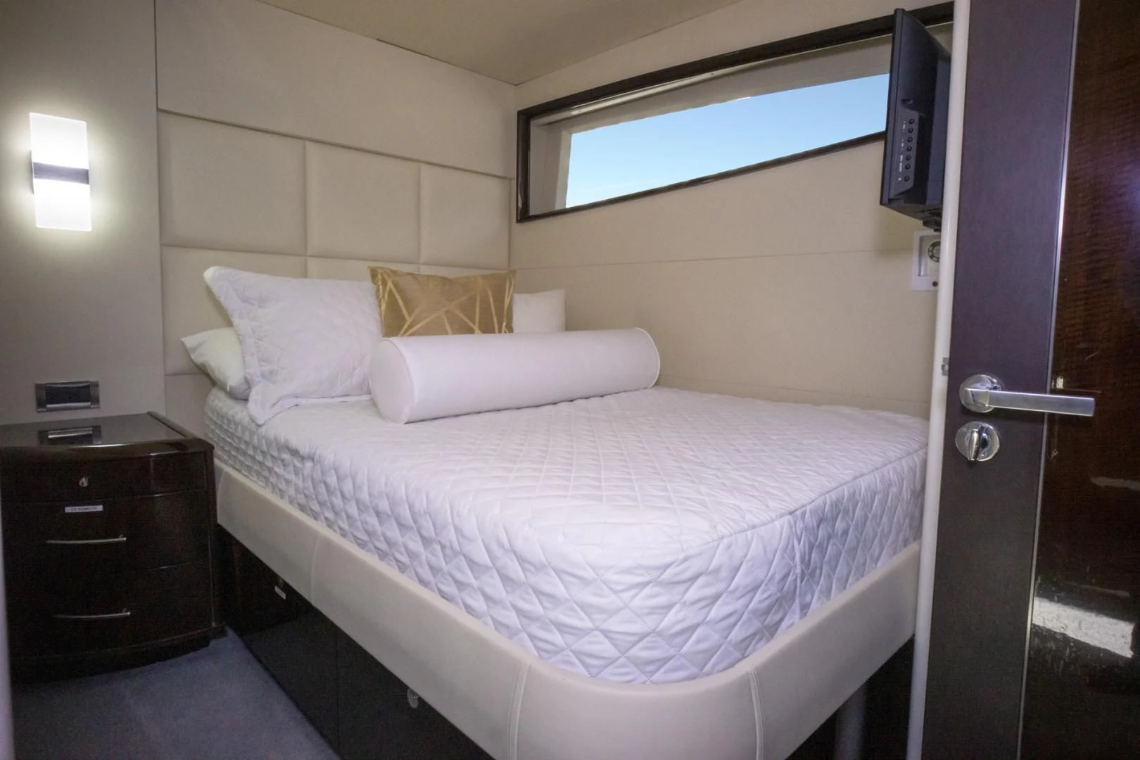 a bed with white sheets aboard SALACIA Yacht for Sale