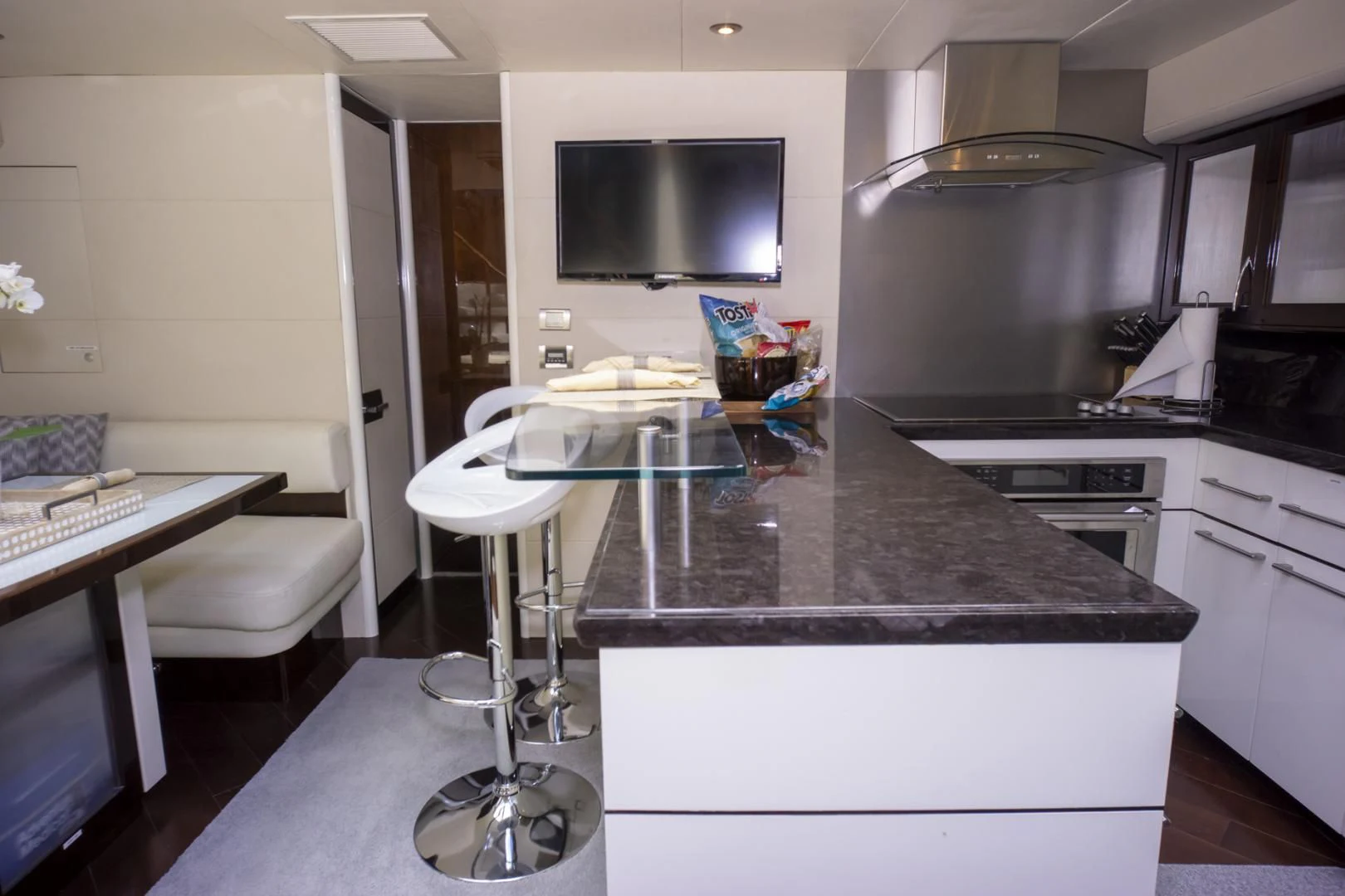 a kitchen with a large island aboard SALACIA Yacht for Sale