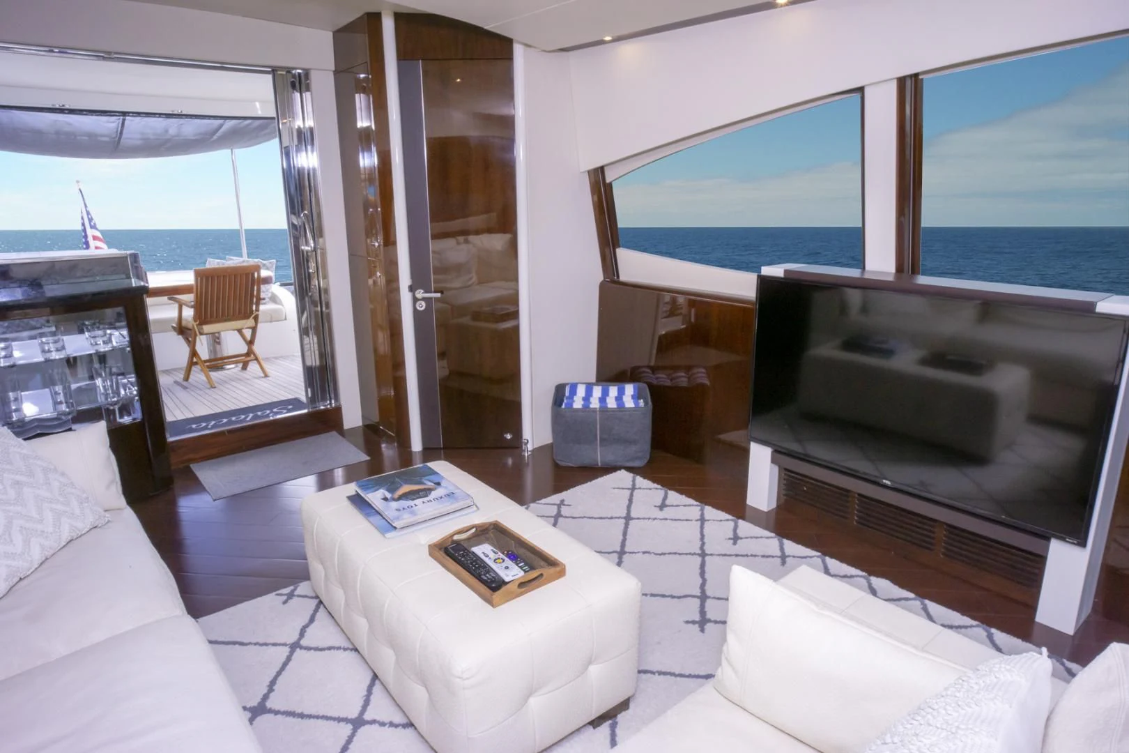 a living room with a large tv aboard SALACIA Yacht for Sale