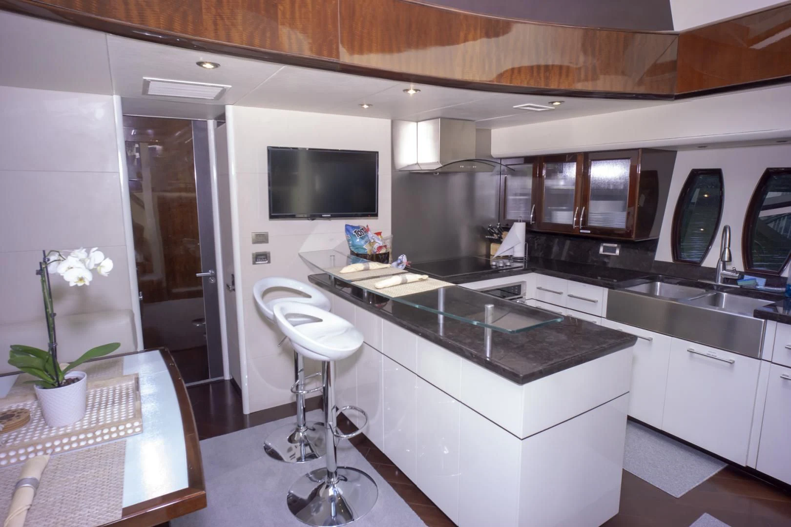 a kitchen with white cabinets aboard SALACIA Yacht for Sale