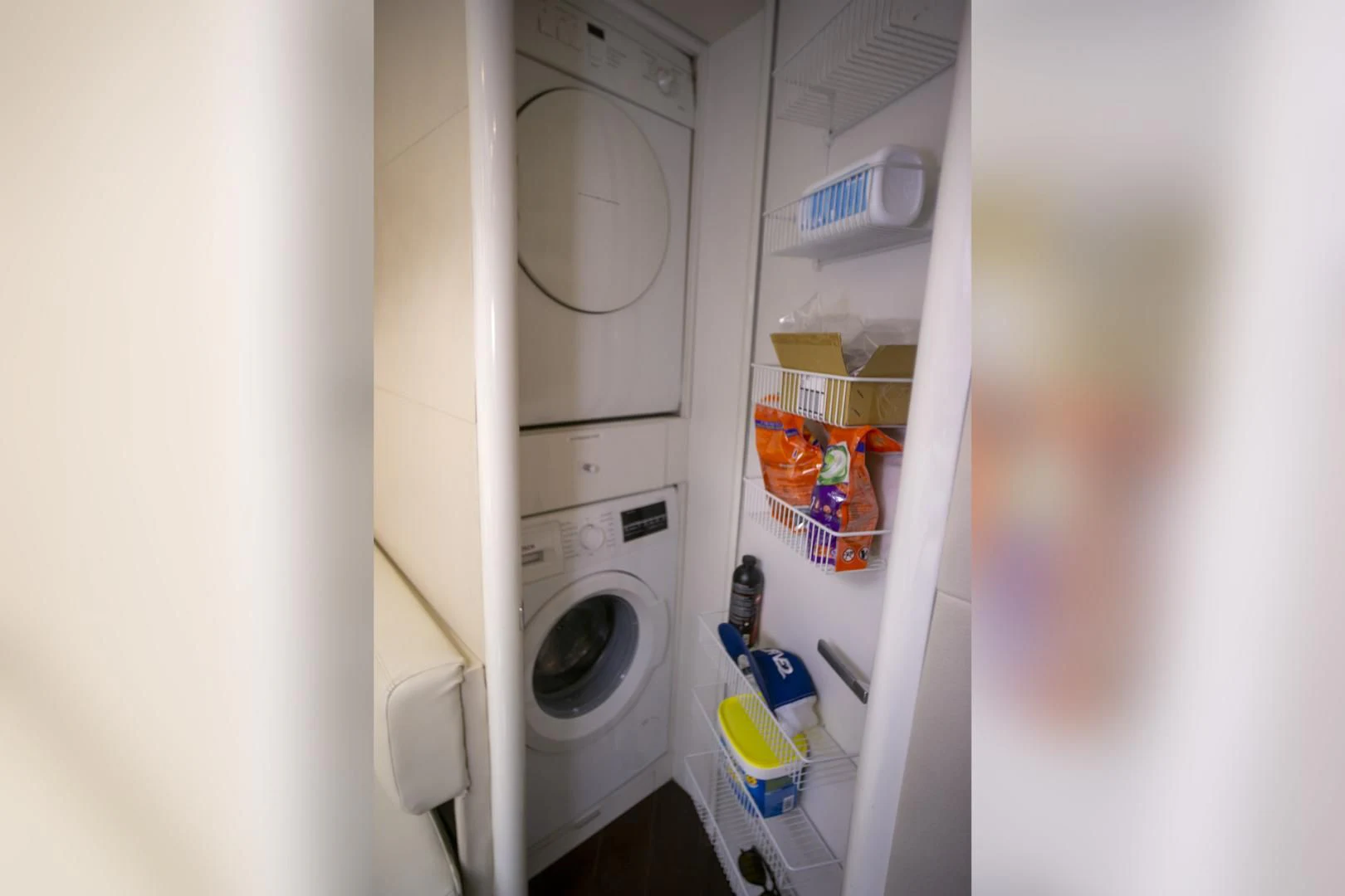 a white laundry room with clothes dryer and clothes dryer aboard SALACIA Yacht for Sale