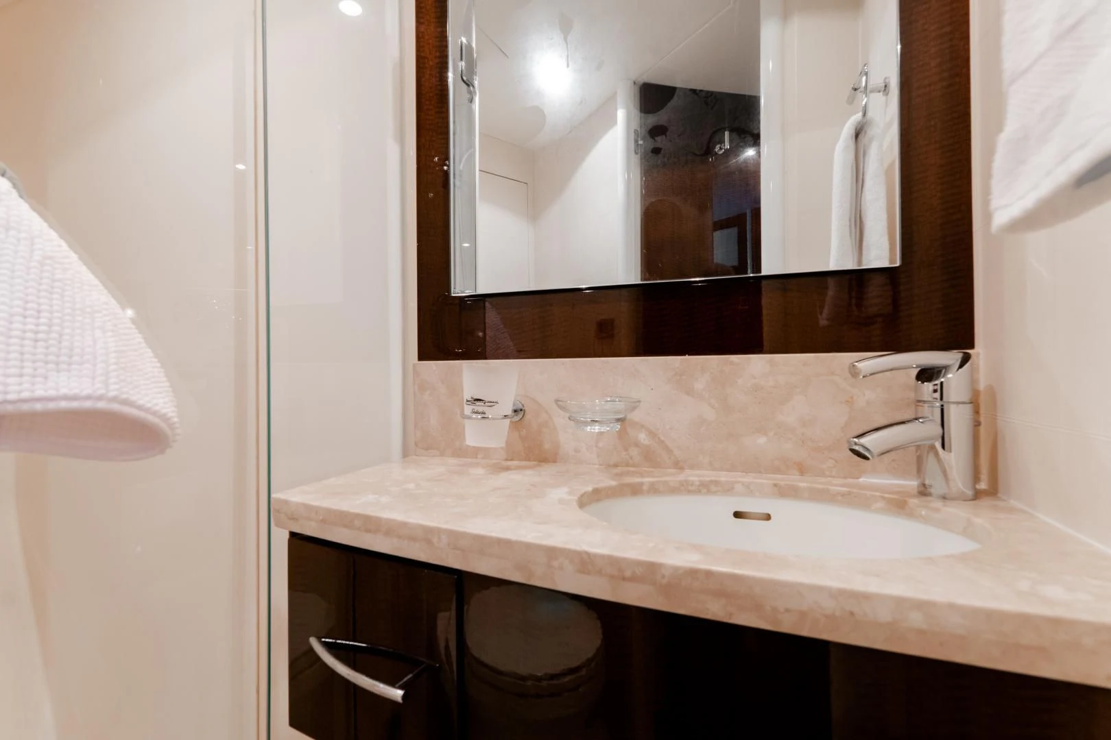 a bathroom with a large mirror aboard SALACIA Yacht for Sale
