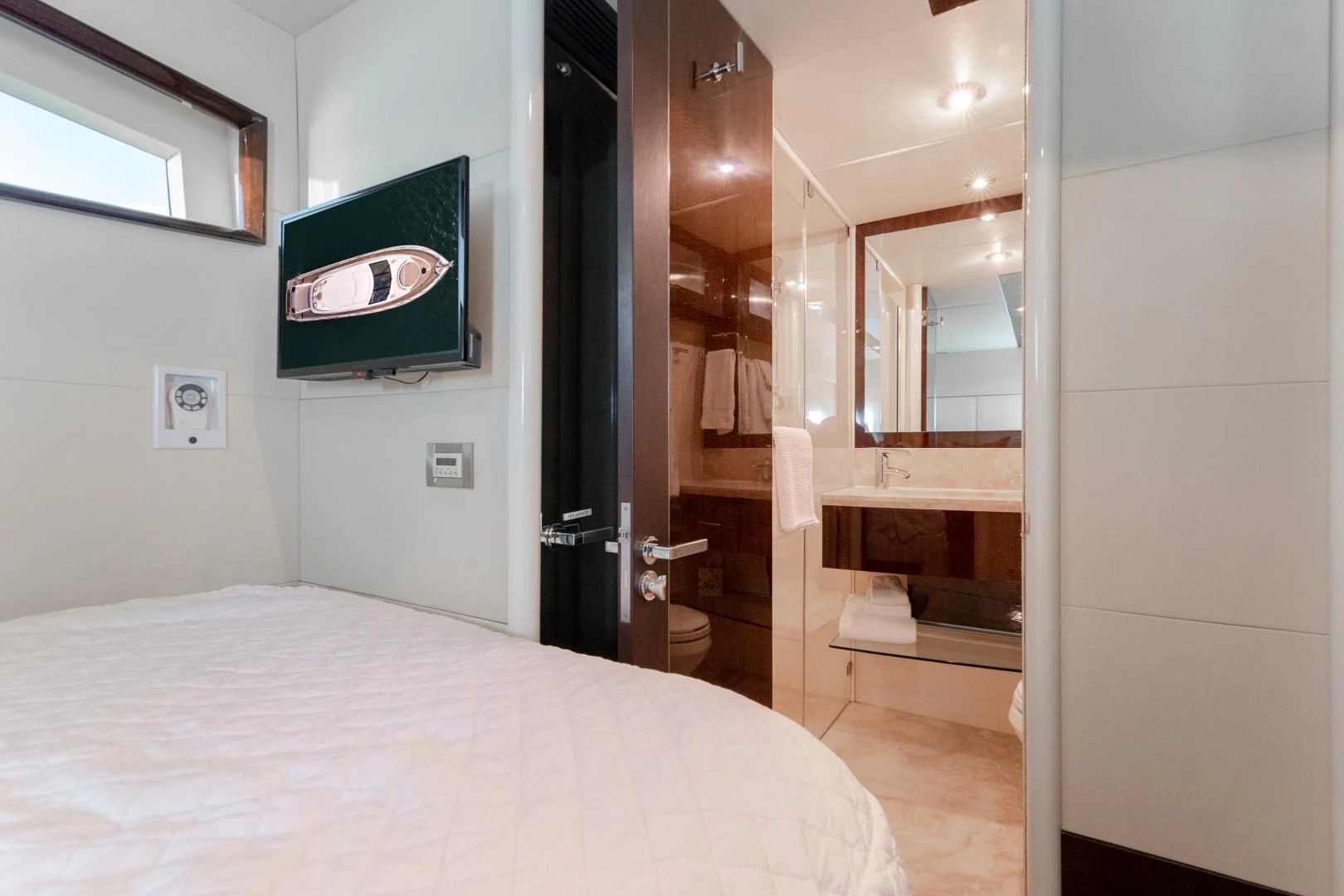 a hotel room with a bed aboard SALACIA Yacht for Sale