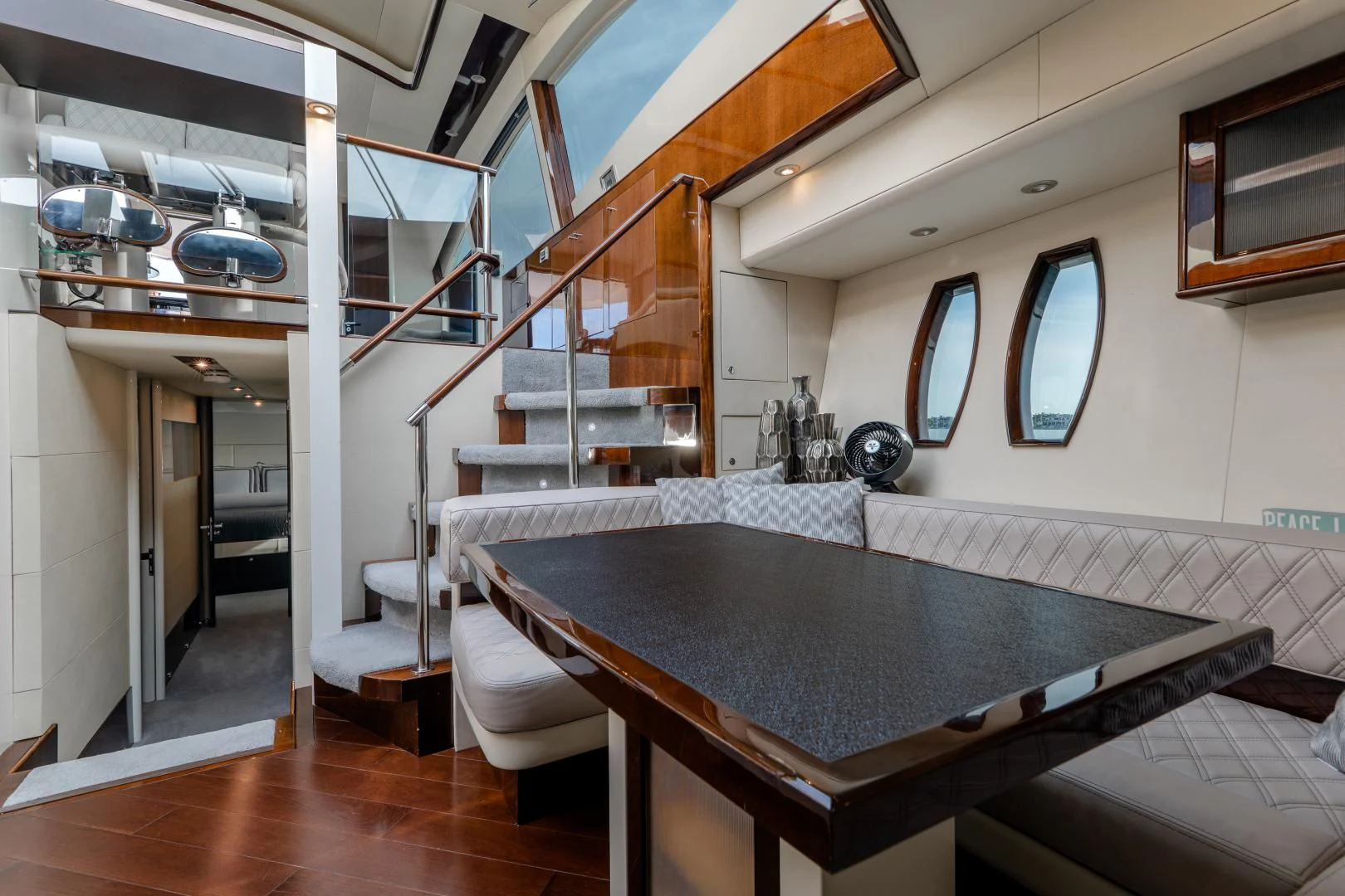 a room with a table and chairs aboard SALACIA Yacht for Sale