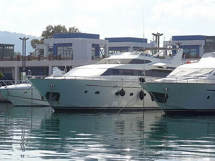 a couple of boats sit in a harbor aboard ILLYA F Yacht for Charter