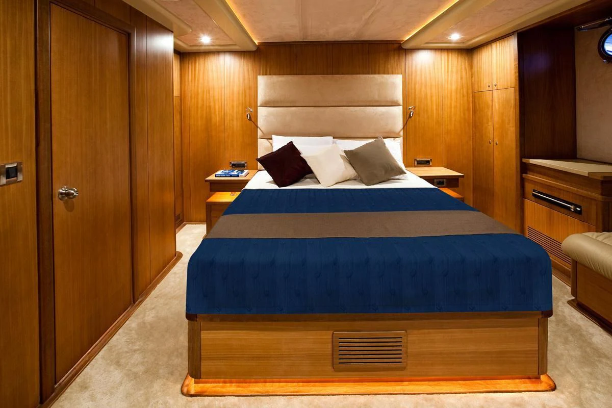 a bed in a room aboard MISS B Yacht for Sale