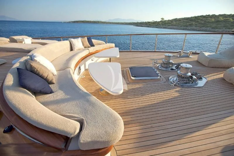 a table with a laptop on it aboard MISS B Yacht for Sale