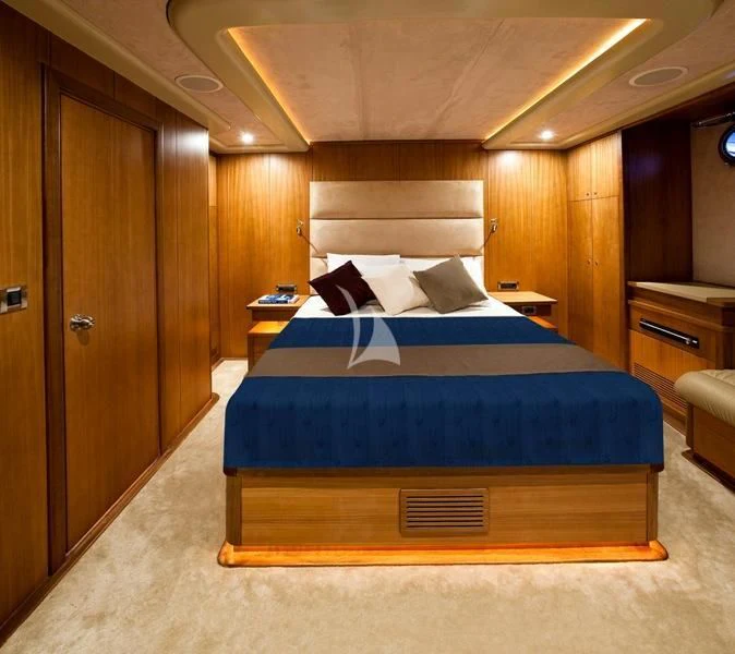 a bed in a room aboard MISS B Yacht for Sale
