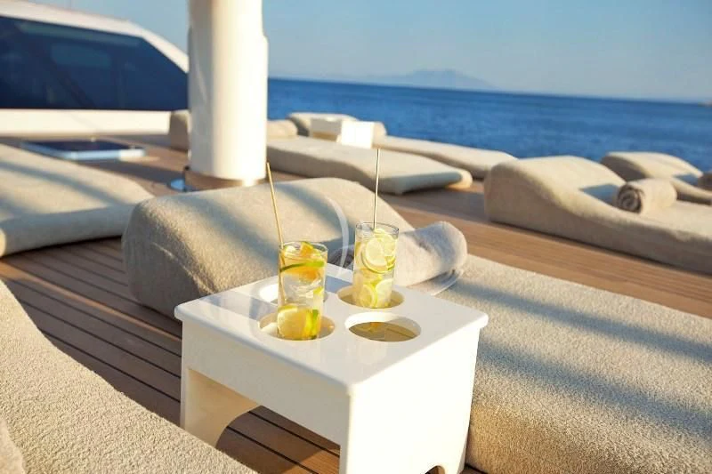 a white table with drinks on it aboard MISS B Yacht for Sale