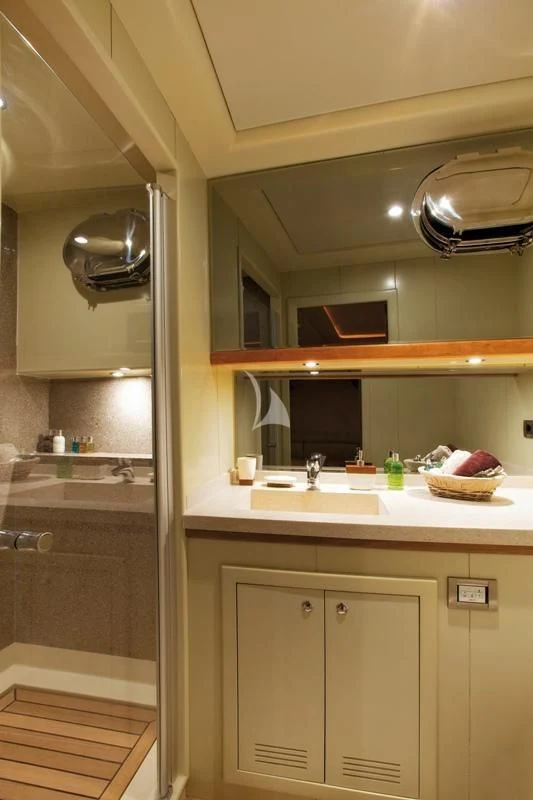 a kitchen with a sink and a microwave aboard MISS B Yacht for Sale