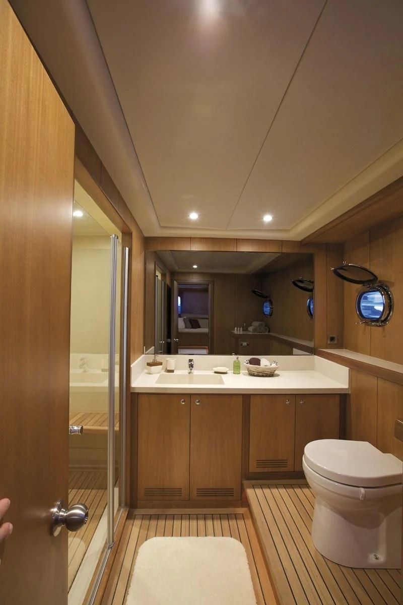 a bathroom with a sink and toilet aboard MISS B Yacht for Sale