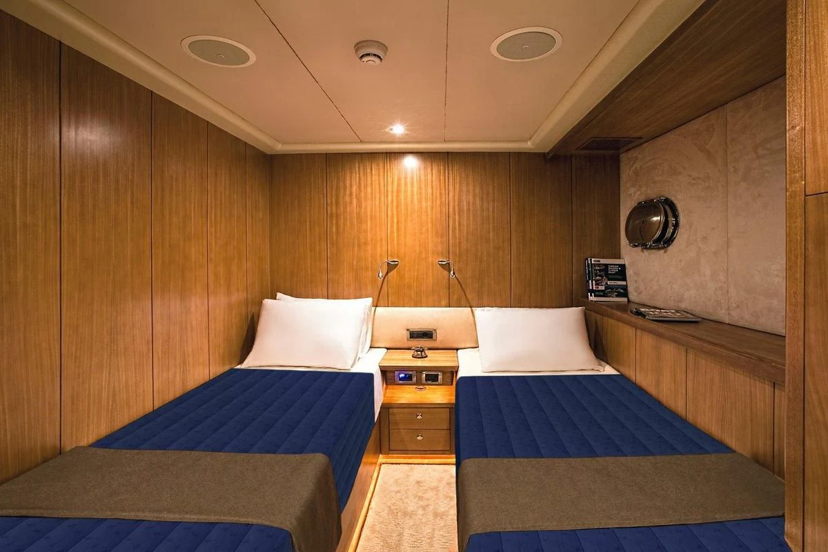 a room with a couple beds aboard MISS B Yacht for Sale