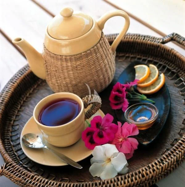 a tea pot and tea set on a table aboard MISS B Yacht for Sale