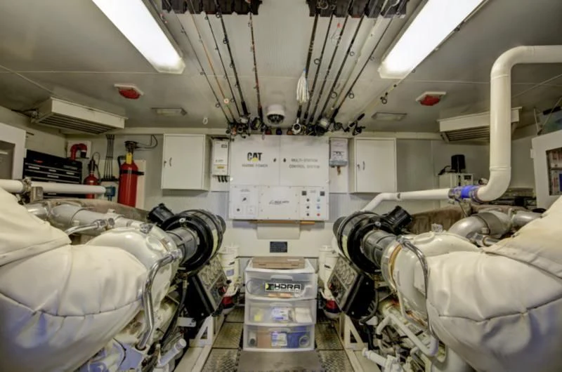 a room with white walls and pipes aboard NO RULES Yacht for Sale