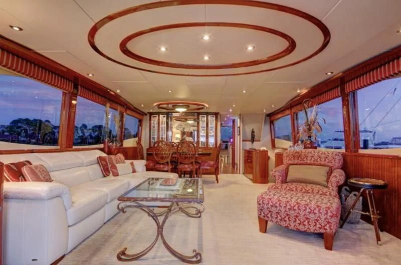 a living room with a large open window aboard NO RULES Yacht for Sale