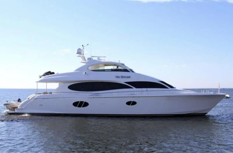 a white yacht on the water aboard NO RULES Yacht for Sale