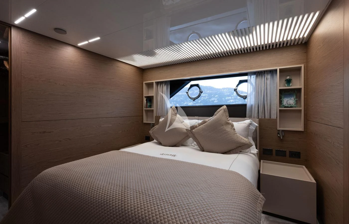 a room with a bed and a window aboard ALEGRIA II Yacht for Sale
