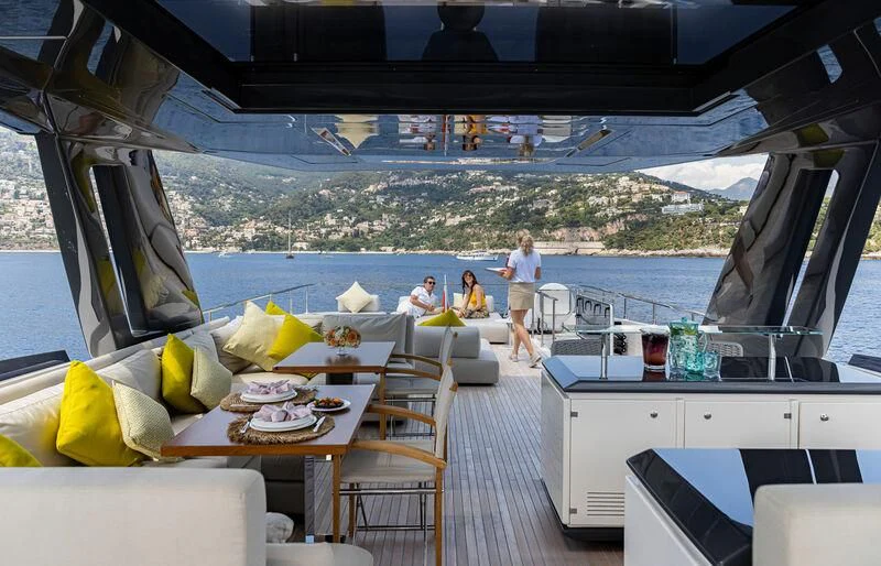 a boat with a table and chairs aboard ALEGRIA II Yacht for Sale