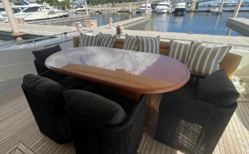 a table and chairs on a patio aboard RABBIT Yacht for Sale