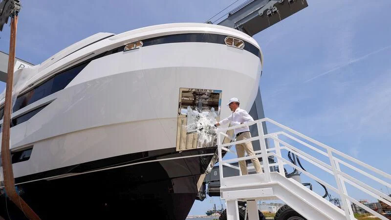 a person standing on the deck of a boat aboard ANDROMEDA Yacht for Sale