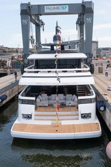 a boat docked at a pier aboard ANDROMEDA Yacht for Sale