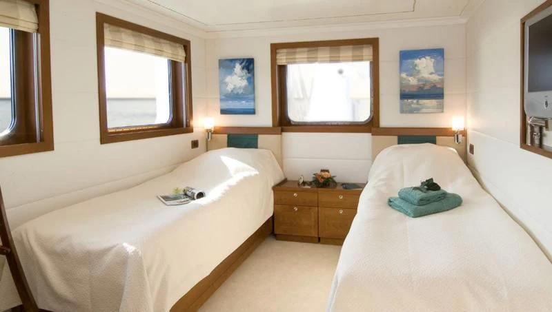 a couple of beds in a hotel room aboard HANSE EXPLORER Yacht for Sale