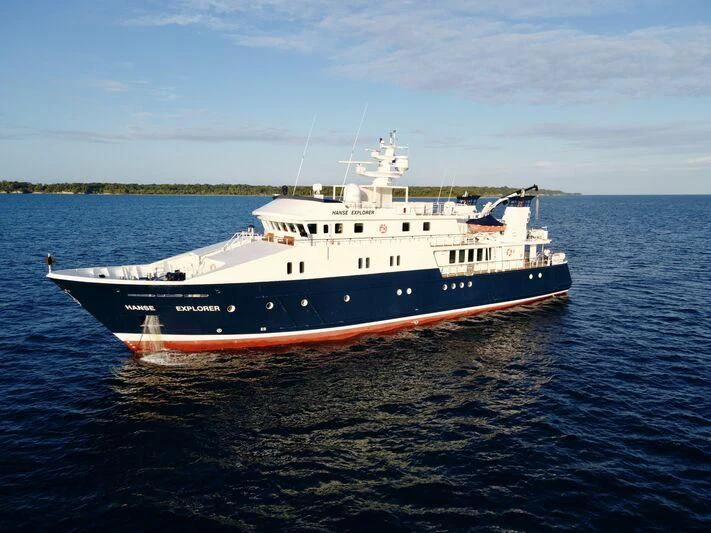 a large white boat on the water aboard HANSE EXPLORER Yacht for Sale