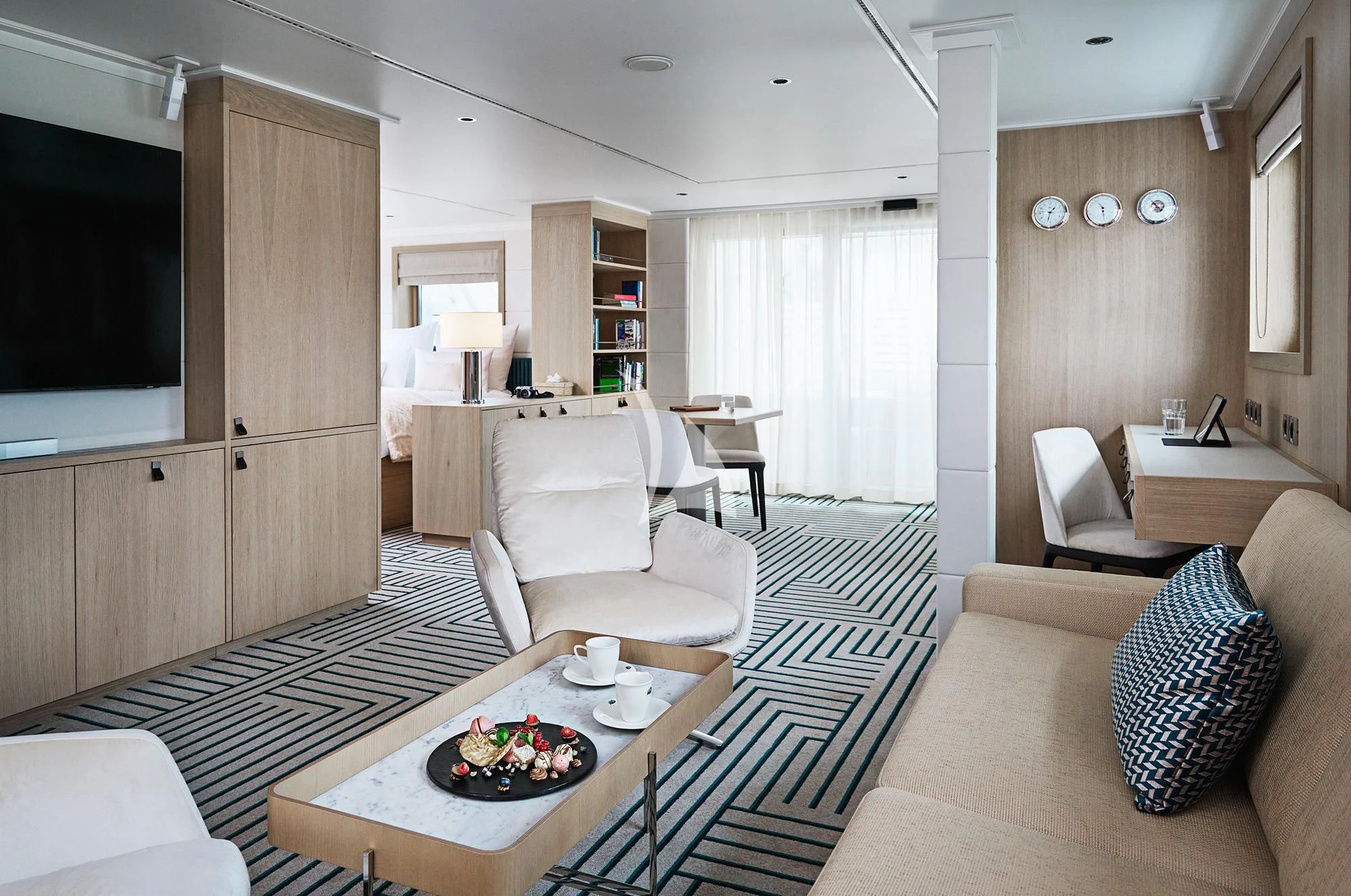 a living room with a couch and a table aboard HANSE EXPLORER Yacht for Sale