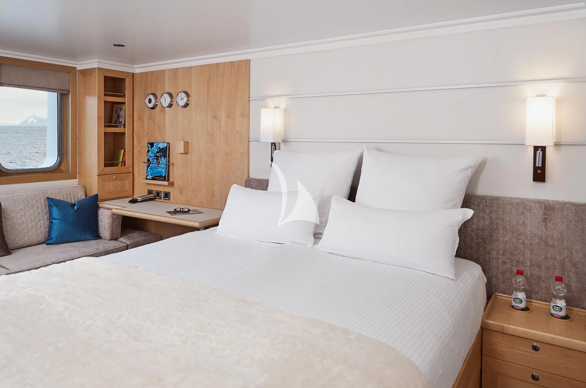 a bed with white sheets and pillows aboard HANSE EXPLORER Yacht for Sale