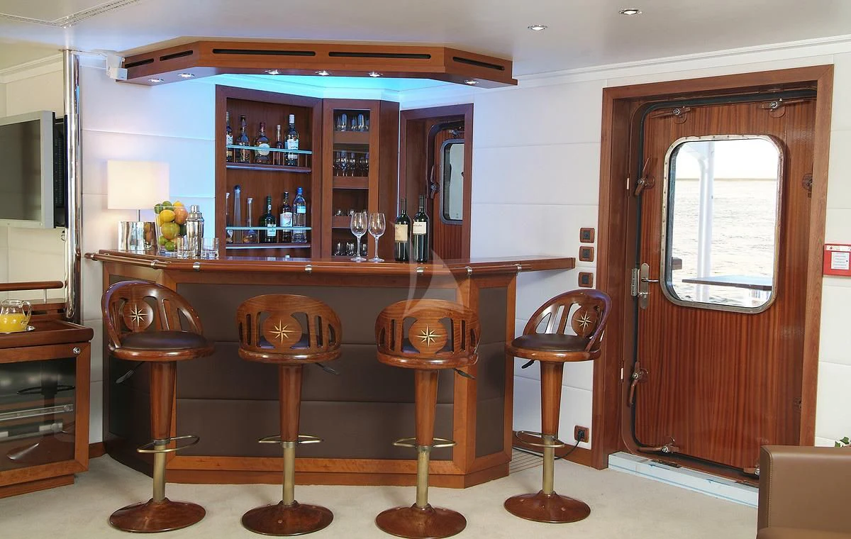 a bar with stools and a bar in it aboard HANSE EXPLORER Yacht for Sale