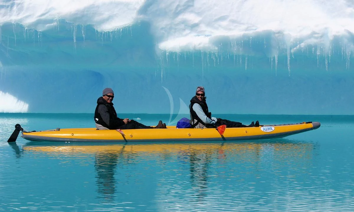 a group of people in a canoe on a lake aboard HANSE EXPLORER Yacht for Sale