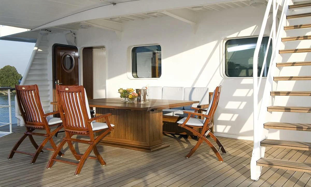 a room with a table and chairs aboard HANSE EXPLORER Yacht for Sale