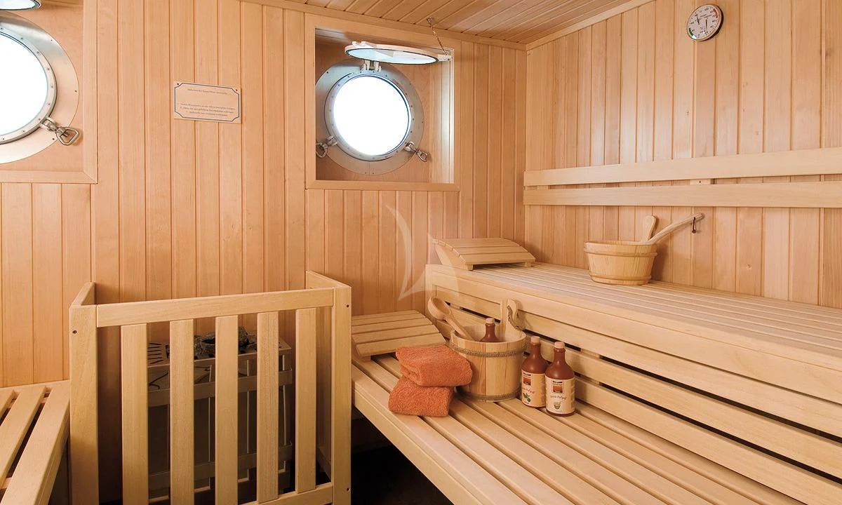 a wooden bathroom with wooden walls aboard HANSE EXPLORER Yacht for Sale