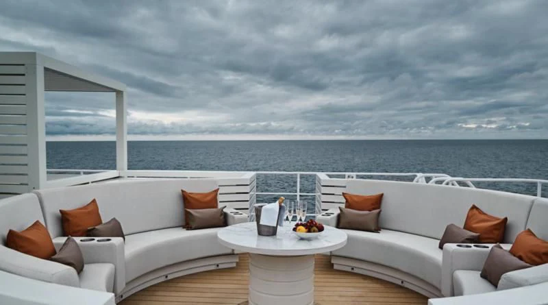 a room with a couch and a table and chairs aboard HANSE EXPLORER Yacht for Sale