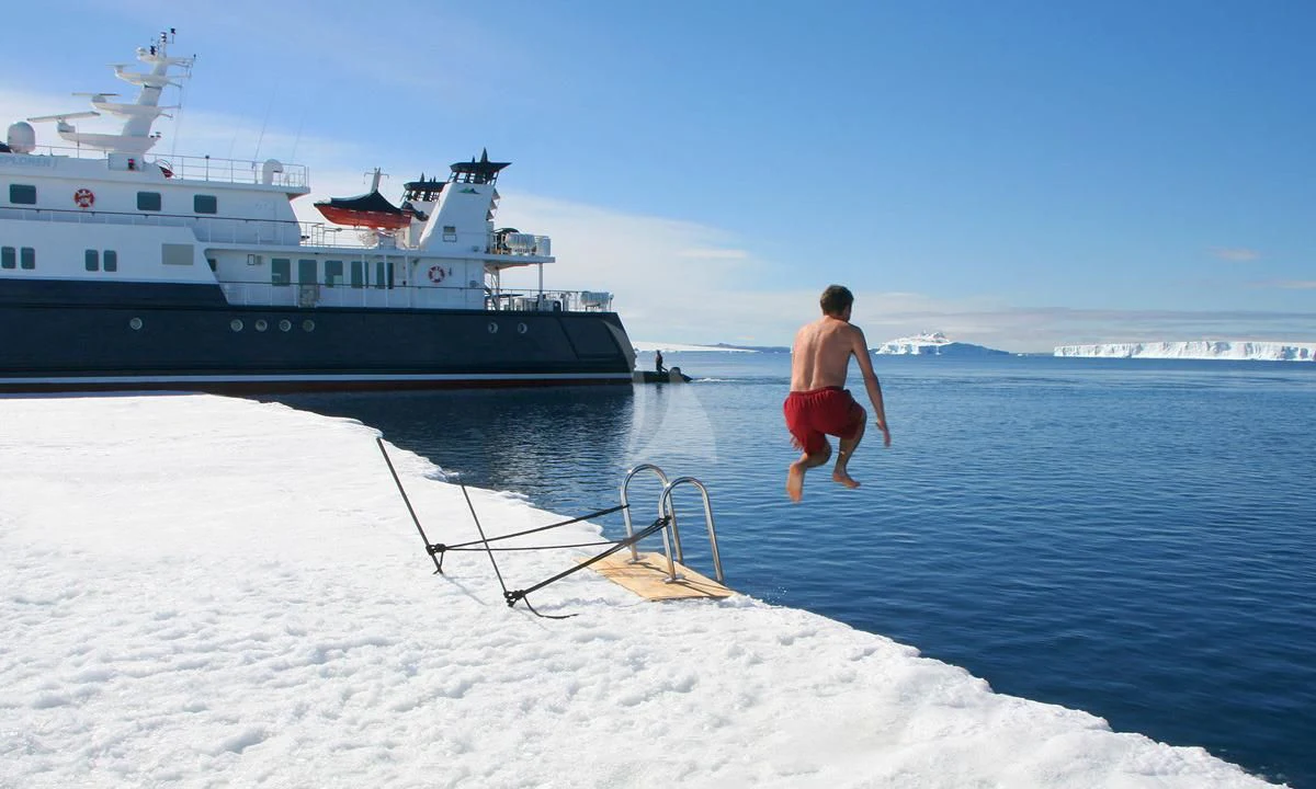 a person walking on a beach aboard HANSE EXPLORER Yacht for Sale