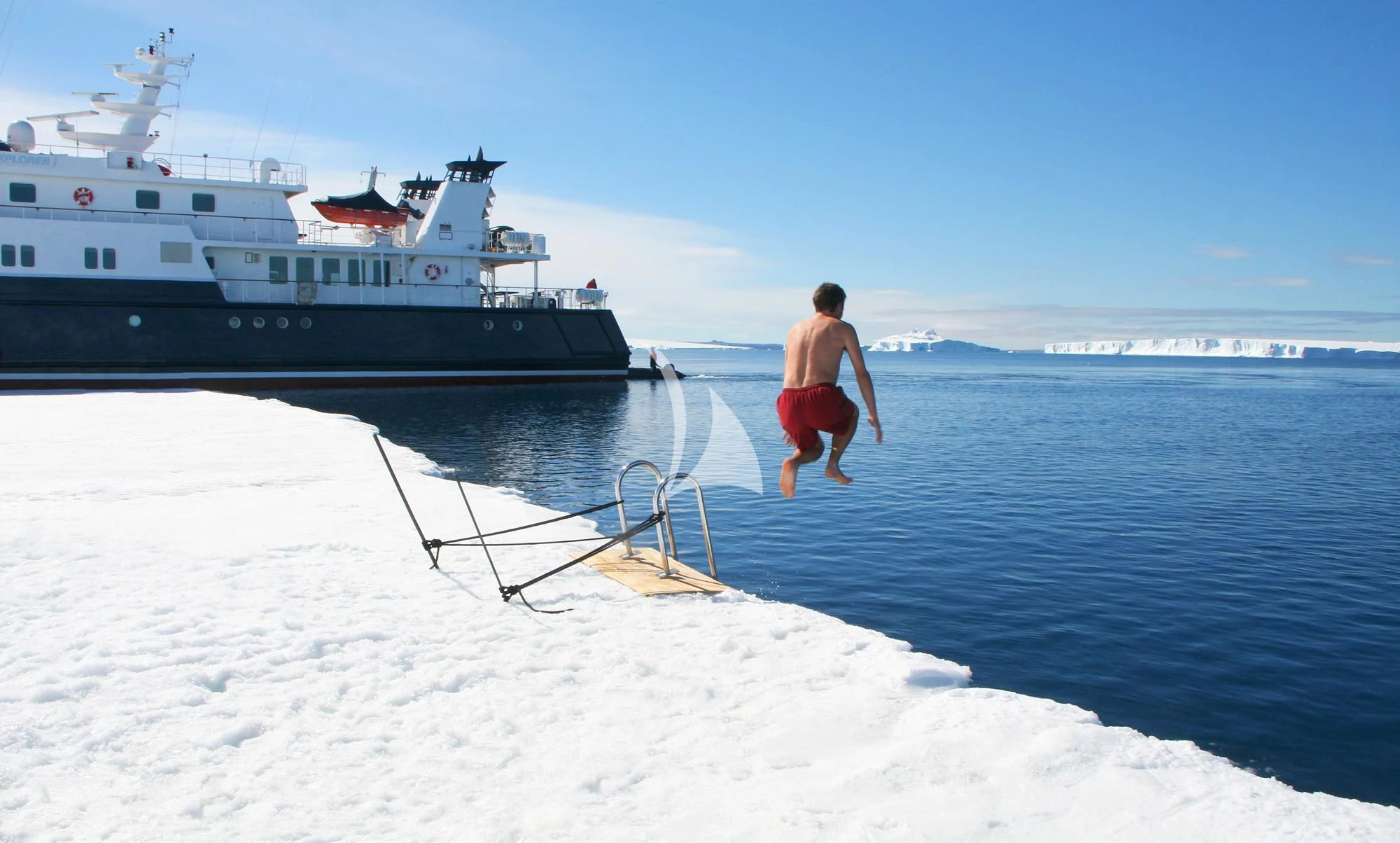 a person walking on a beach aboard HANSE EXPLORER Yacht for Sale