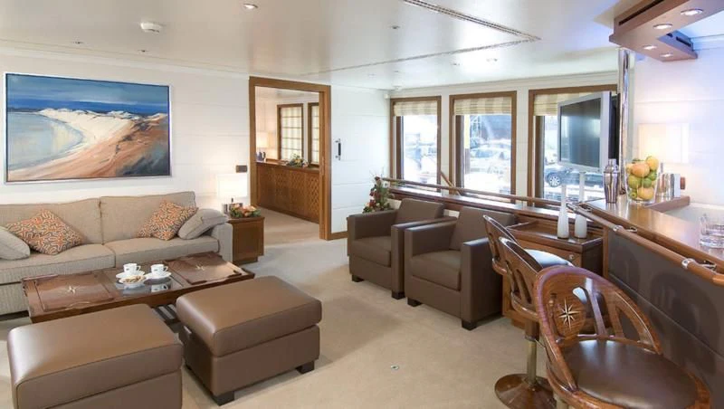 a living room with a couch and a table aboard HANSE EXPLORER Yacht for Sale