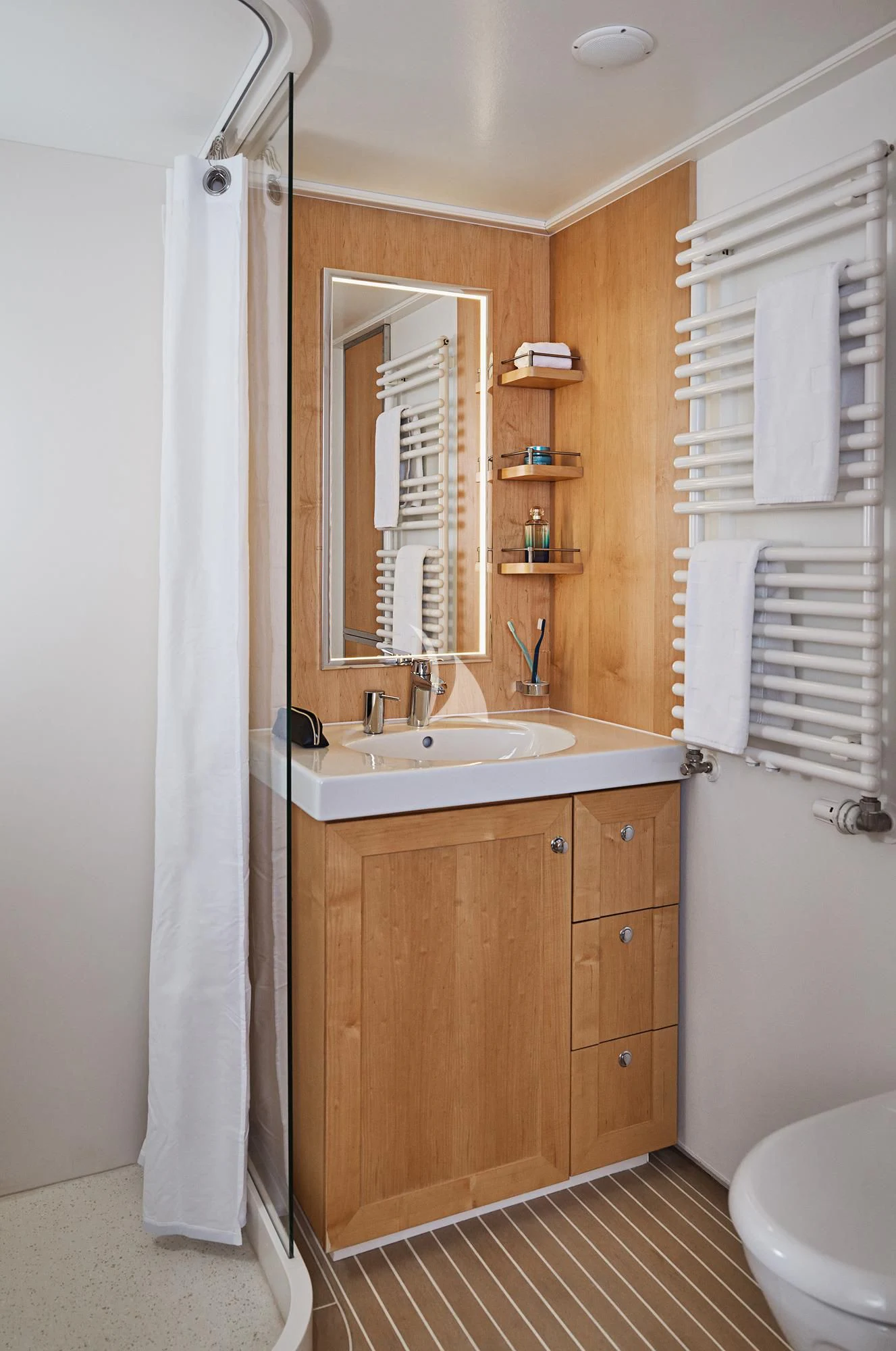 a bathroom with a sink and a mirror aboard HANSE EXPLORER Yacht for Sale