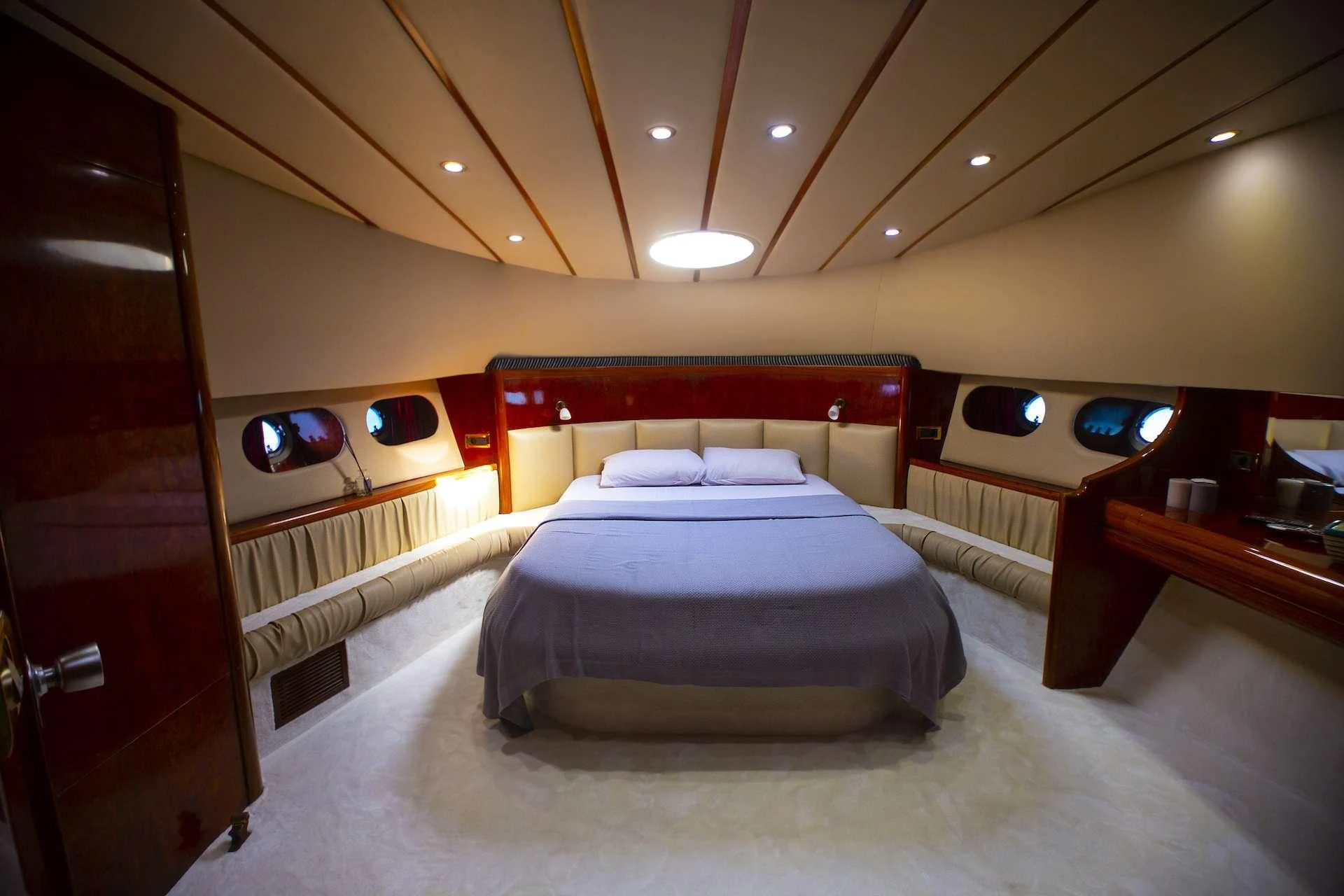 a room with a bed and a mirror aboard ERDOGAN Yacht for Sale