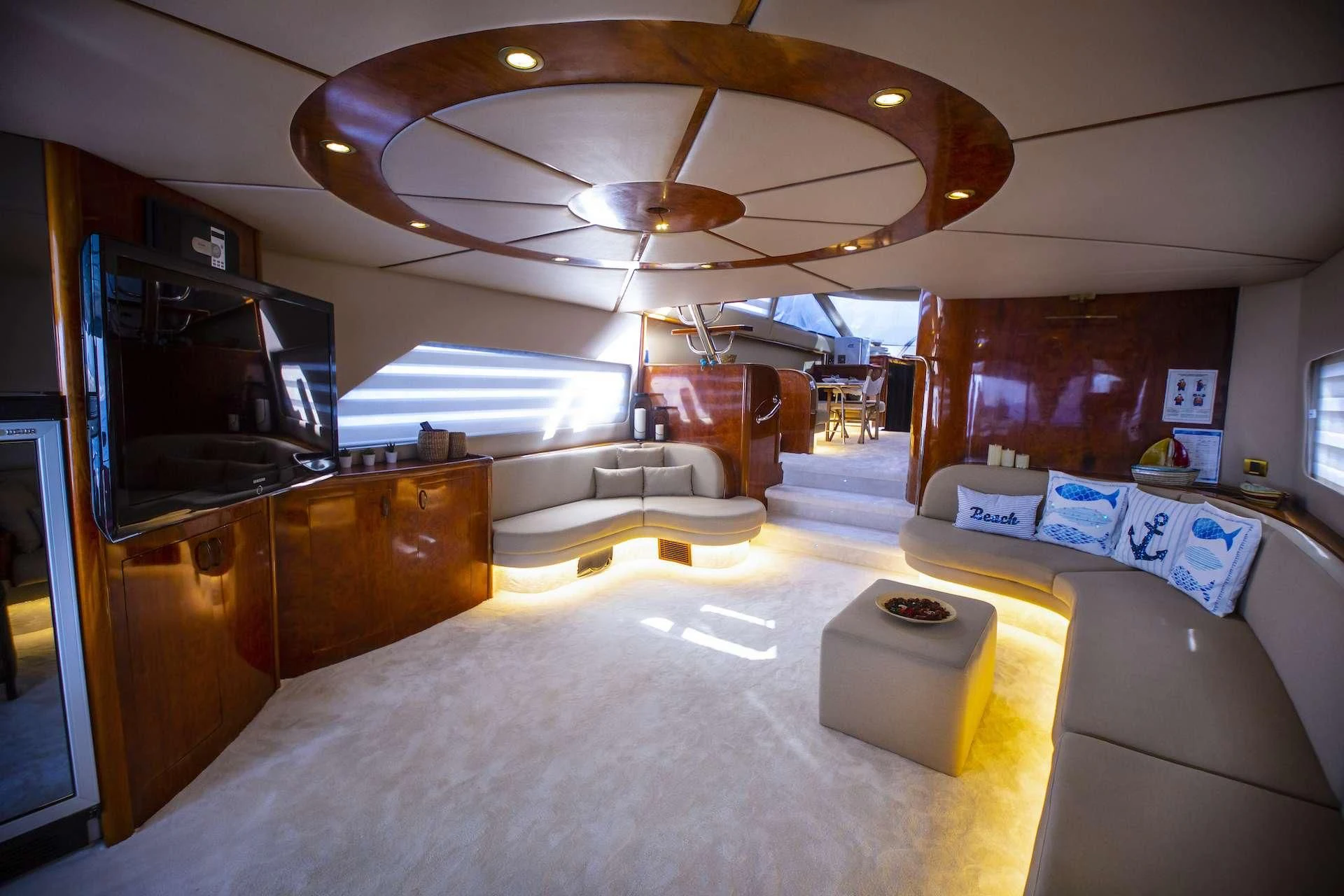 a room with a couch and a television aboard ERDOGAN Yacht for Sale