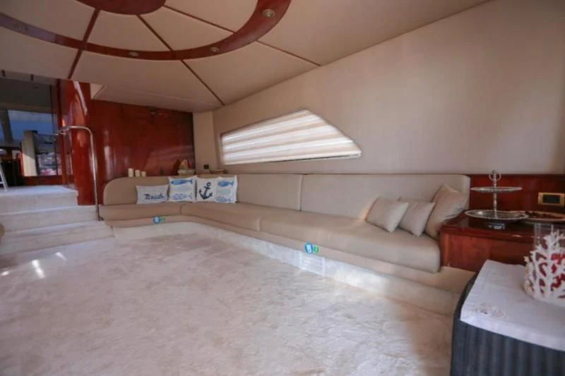 a living room with a couch and a staircase aboard ERDOGAN Yacht for Sale