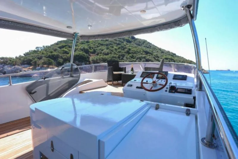a boat with a steering wheel aboard ERDOGAN Yacht for Sale