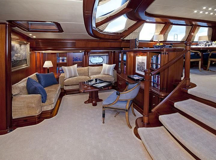 a room with a couch and a table aboard HYPERION Yacht for Charter