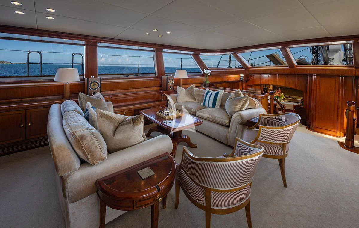 a living room with a couch and a coffee table aboard HYPERION Yacht for Charter