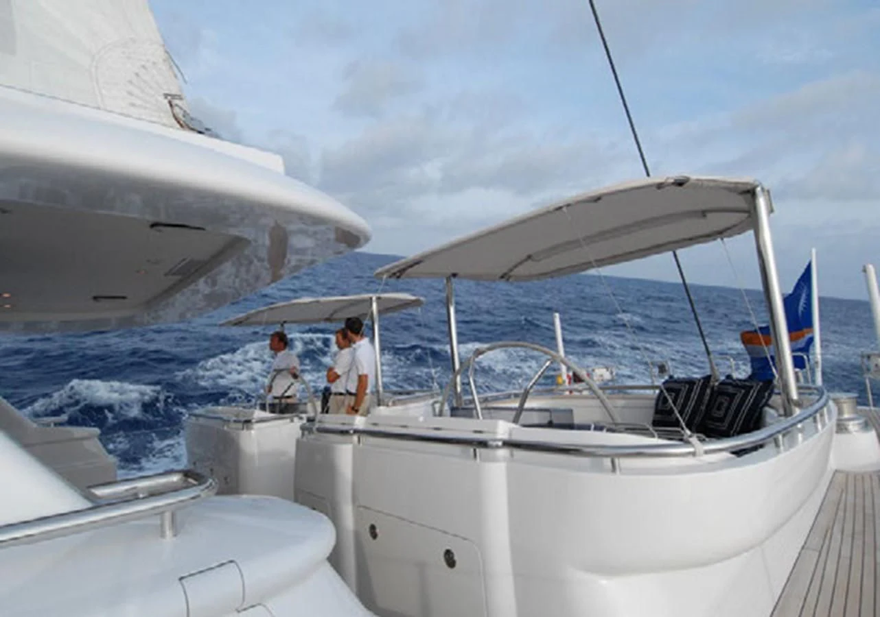 a couple of people on a boat aboard HYPERION Yacht for Charter